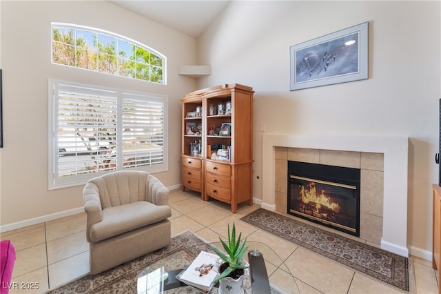 7945 Delbonita Ave, Las Vegas, NV 89147 - sitting room with a tile fireplace, light tile patterned floors, and baseboards
