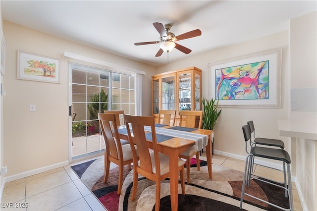 7945 Delbonita Ave, Las Vegas, NV 89147 - dining space featuring light tile patterned floors, ceiling fan, and baseboards