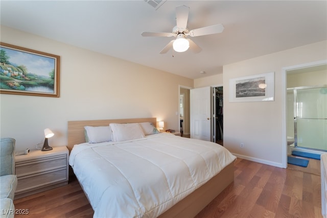 7945 Delbonita Ave, Las Vegas, NV 89147 - bedroom with wood finished floors, baseboards, a spacious closet, and connected bathroom