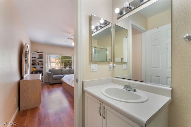 7945 Delbonita Ave, Las Vegas, NV 89147 - bathroom featuring vanity, a ceiling fan, and wood finished floors