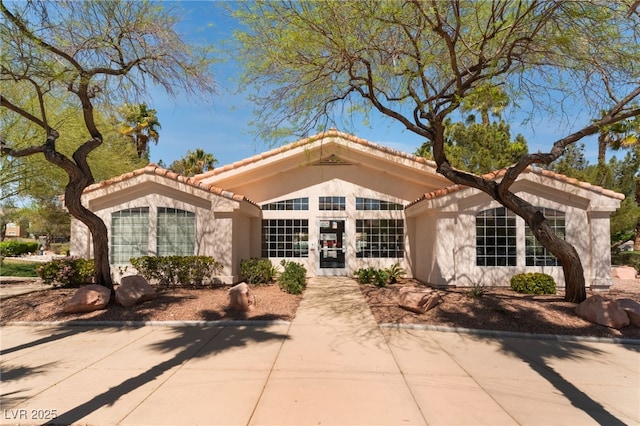 7945 Delbonita Ave, Las Vegas, NV 89147 - view of front of property with stucco siding and a tile roof