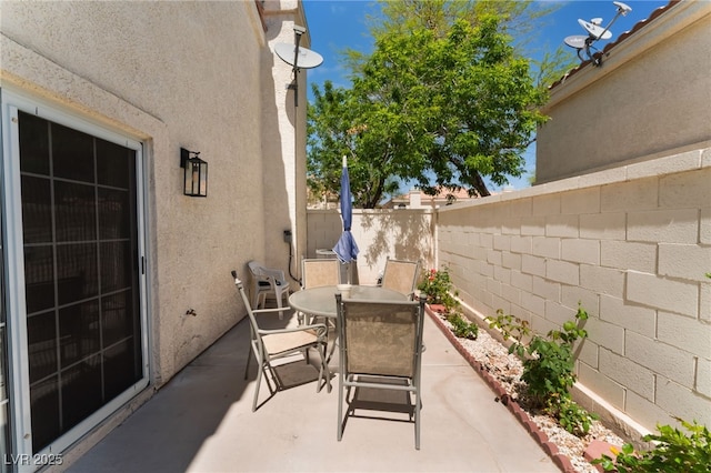 7945 Delbonita Ave, Las Vegas, NV 89147 - view of patio / terrace with a fenced backyard and outdoor dining space