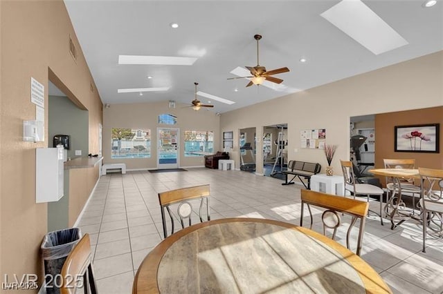 7945 Delbonita Ave, Las Vegas, NV 89147 - dining space with visible vents, a skylight, a ceiling fan, and light tile patterned flooring