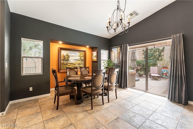 dining space featuring baseboards, vaulted ceiling, visible vents, and a chandelier