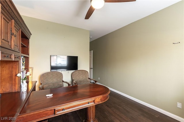 office space with baseboards, ceiling fan, and dark wood-style flooring