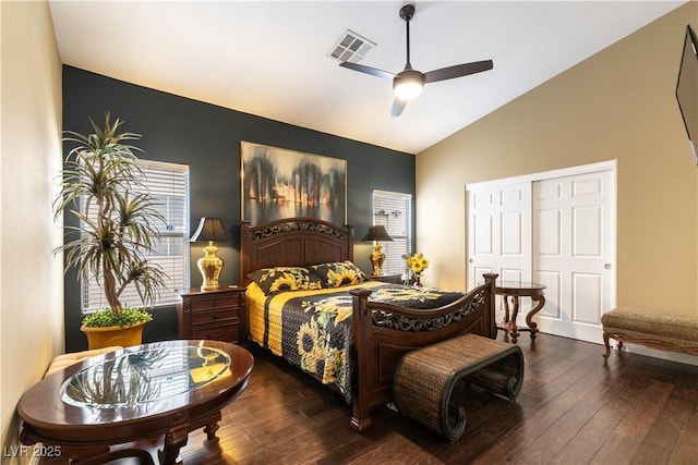 bedroom featuring hardwood / wood-style flooring, ceiling fan, visible vents, and high vaulted ceiling