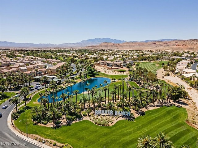 birds eye view of property featuring a water and mountain view, a residential view, and view of golf course