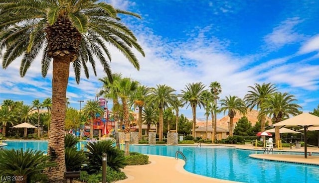community pool with a patio area