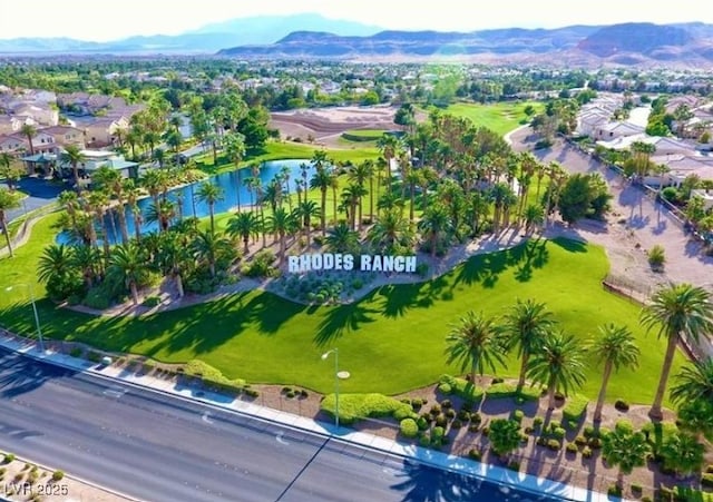 birds eye view of property featuring a residential view and a water and mountain view