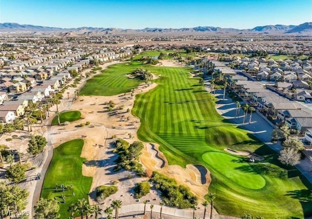 birds eye view of property with a residential view, view of golf course, and a mountain view