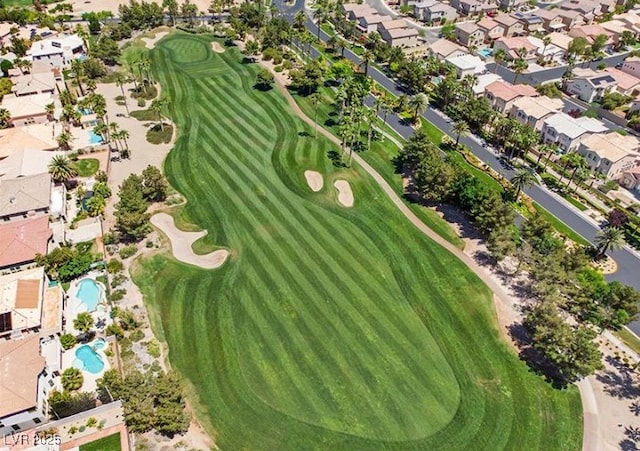 drone / aerial view featuring a residential view and golf course view