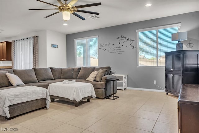 living room with baseboards, recessed lighting, light tile patterned floors, visible vents, and ceiling fan