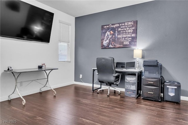 home office featuring baseboards and wood finished floors