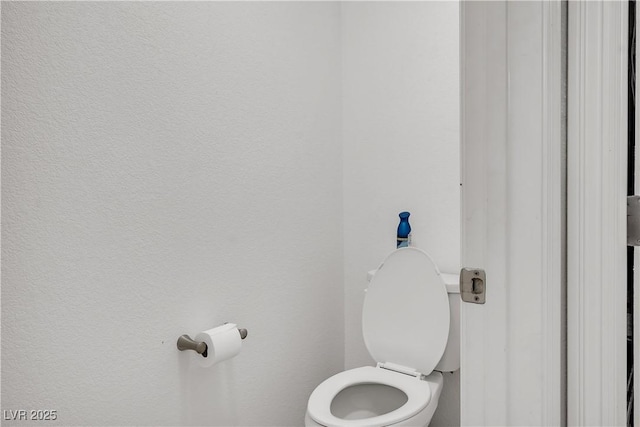 bathroom featuring toilet