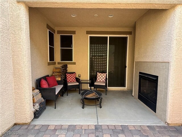 view of patio / terrace with a fireplace