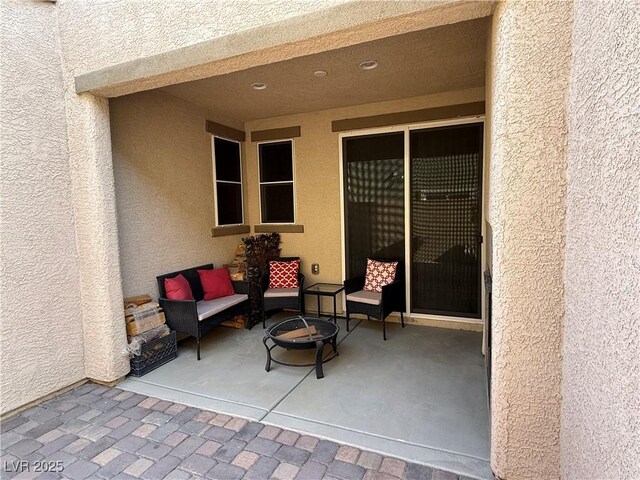 view of patio featuring an outdoor fire pit