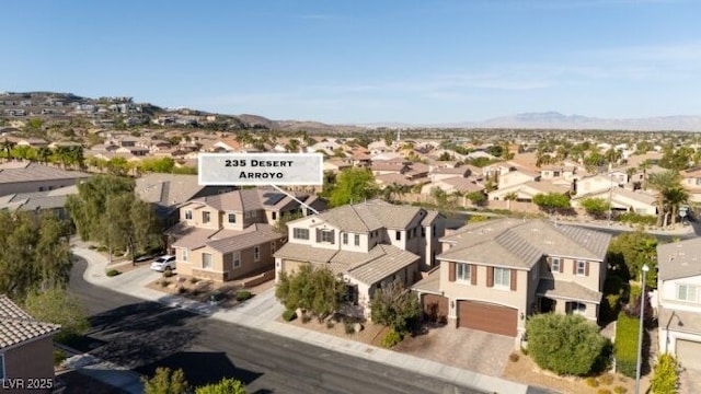 birds eye view of property with a residential view