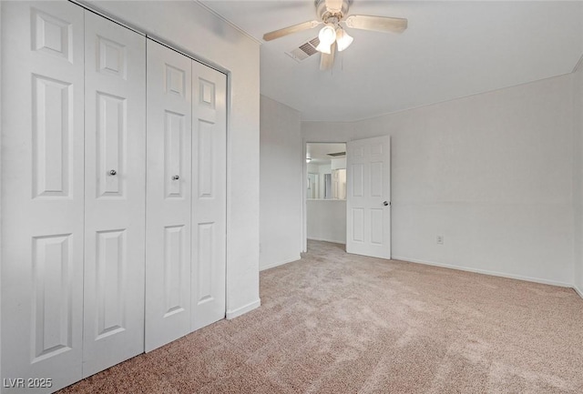 unfurnished bedroom featuring visible vents, baseboards, carpet flooring, and a closet