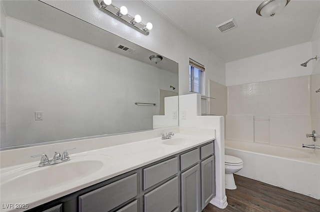 full bathroom featuring a sink, visible vents, and toilet