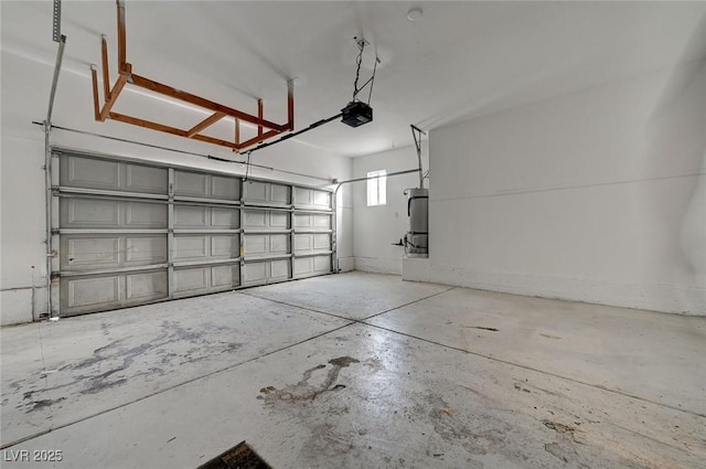garage featuring secured water heater and a garage door opener