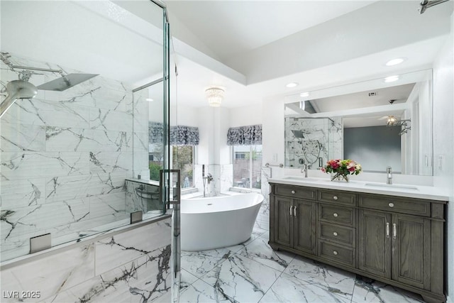 2401 Rice Flower Cir, Las Vegas, NV 89134 - full bathroom featuring marble tiled floors, a marble finish shower, double vanity, a freestanding tub, and lofted ceiling