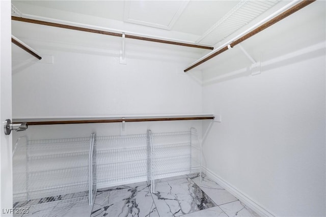 2401 Rice Flower Cir, Las Vegas, NV 89134 - spacious closet with marble look tile flooring