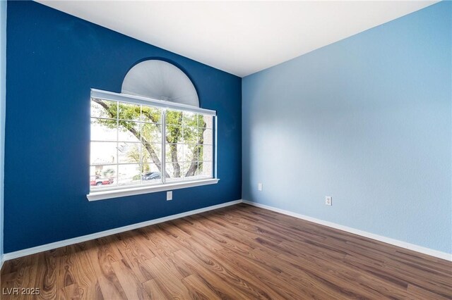 2401 Rice Flower Cir, Las Vegas, NV 89134 - unfurnished room with wood finished floors and baseboards
