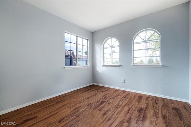 2401 Rice Flower Cir, Las Vegas, NV 89134 - spare room with dark wood-style floors and baseboards