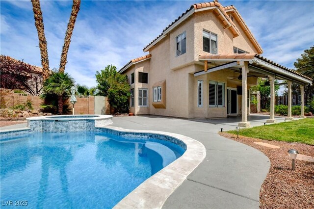 2401 Rice Flower Cir, Las Vegas, NV 89134 - view of pool with ceiling fan, a fenced backyard, a patio area, and a pool with connected hot tub