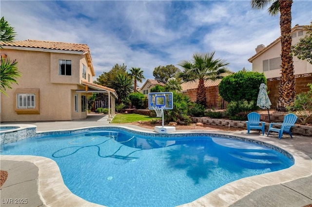 2401 Rice Flower Cir, Las Vegas, NV 89134 - view of swimming pool with a patio, a fenced backyard, and a pool with connected hot tub