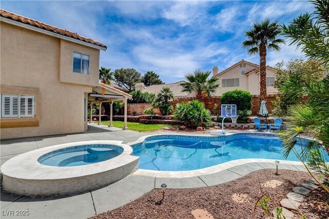 2401 Rice Flower Cir, Las Vegas, NV 89134 - view of pool featuring a fenced backyard, a patio, and a pool with connected hot tub