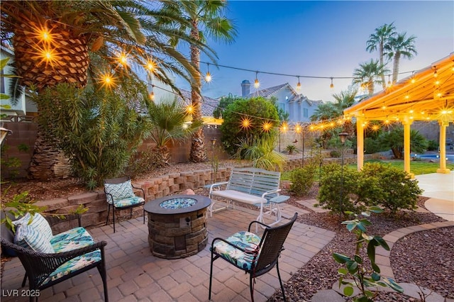 2401 Rice Flower Cir, Las Vegas, NV 89134 - view of patio featuring an outdoor fire pit and fence