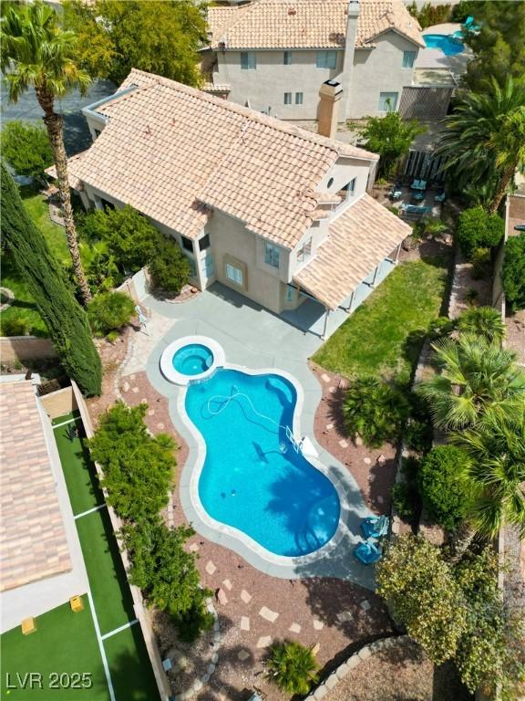 2401 Rice Flower Cir, Las Vegas, NV 89134 - view of pool with a fenced backyard and a pool with connected hot tub