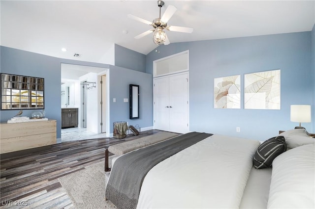2401 Rice Flower Cir, Las Vegas, NV 89134 - bedroom featuring wood finished floors, a closet, ceiling fan, high vaulted ceiling, and ensuite bathroom