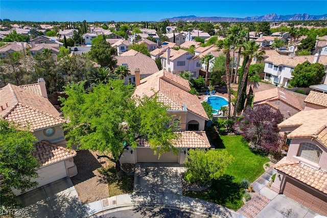 2401 Rice Flower Cir, Las Vegas, NV 89134 - aerial perspective of suburban area with a pool and a mountainous background
