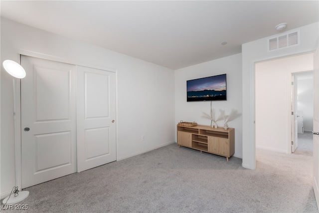 2902 Hemi Orange Ave, North Las Vegas, NV 89086 - unfurnished bedroom with visible vents, a closet, baseboards, and carpet floors