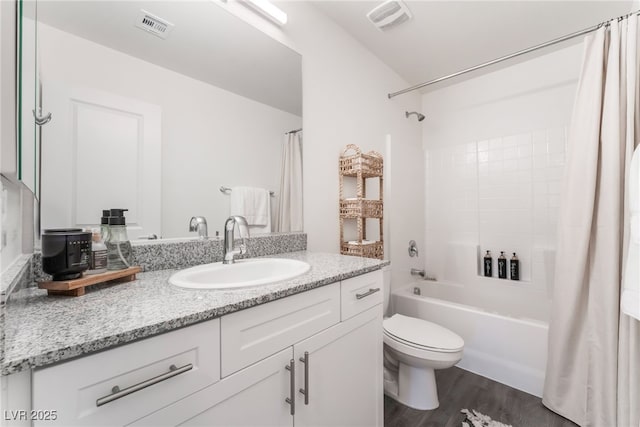 2902 Hemi Orange Ave, North Las Vegas, NV 89086 - bathroom with visible vents, toilet, wood finished floors, and shower / bath combination with curtain