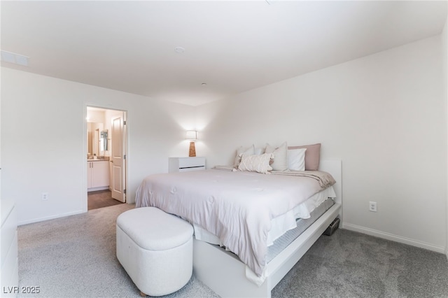 2902 Hemi Orange Ave, North Las Vegas, NV 89086 - carpeted bedroom featuring ensuite bathroom and baseboards