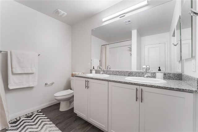 2902 Hemi Orange Ave, North Las Vegas, NV 89086 - bathroom featuring toilet, wood finished floors, a sink, and visible vents