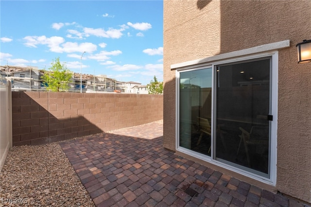 2902 Hemi Orange Ave, North Las Vegas, NV 89086 - view of patio / terrace featuring fence and a residential view