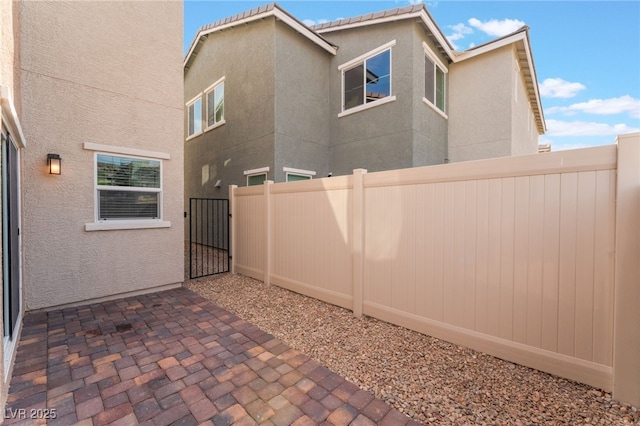 2902 Hemi Orange Ave, North Las Vegas, NV 89086 - exterior space with a patio area, a gate, fence private yard, and stucco siding