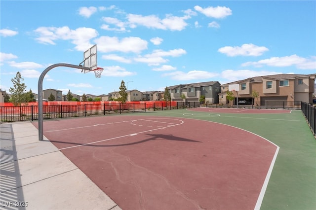 2902 Hemi Orange Ave, North Las Vegas, NV 89086 - view of sport court with community basketball court, fence, and a residential view