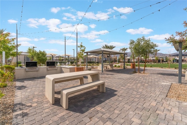 2902 Hemi Orange Ave, North Las Vegas, NV 89086 - view of property's community with area for grilling and a patio area