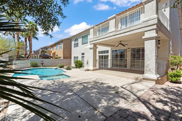 2445 Antler Point Dr, Henderson, NV 89074 - view of pool with a patio, a fenced backyard, a pool with connected hot tub, and a ceiling fan