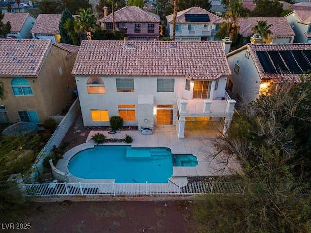 2445 Antler Point Dr, Henderson, NV 89074 - back of property with a tiled roof, a fenced backyard, and a residential view