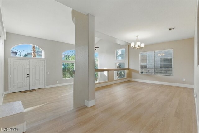 2445 Antler Point Dr, Henderson, NV 89074 - entrance foyer with a chandelier and light wood-type flooring