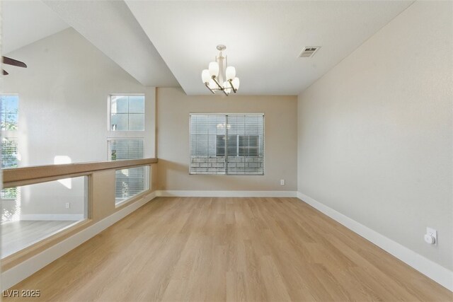 2445 Antler Point Dr, Henderson, NV 89074 - spare room featuring a chandelier, wood finished floors, and ceiling fan