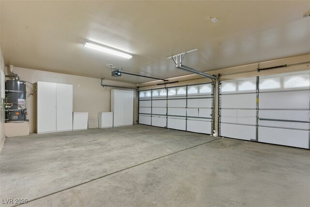 2445 Antler Point Dr, Henderson, NV 89074 - garage with a garage door opener and strapped water heater