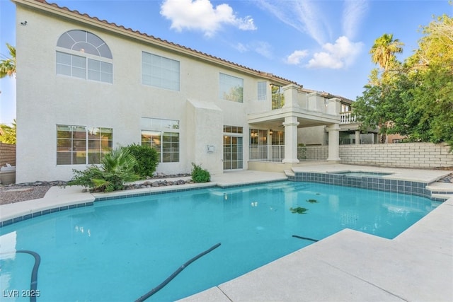 2445 Antler Point Dr, Henderson, NV 89074 - view of swimming pool with an in-ground hot tub and a patio area