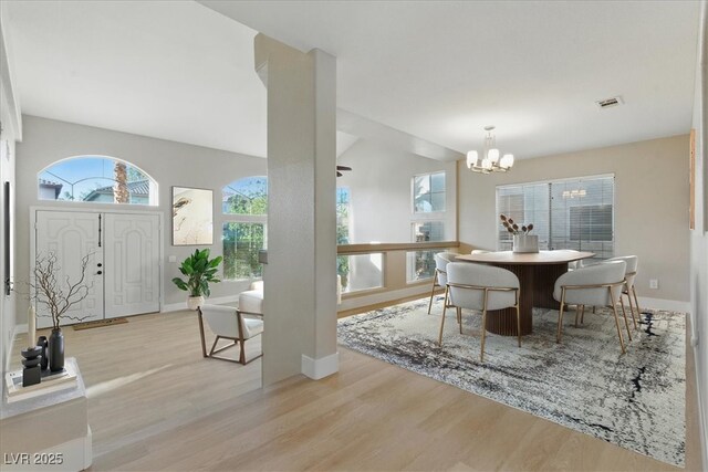 2445 Antler Point Dr, Henderson, NV 89074 - dining space with a chandelier and wood finished floors